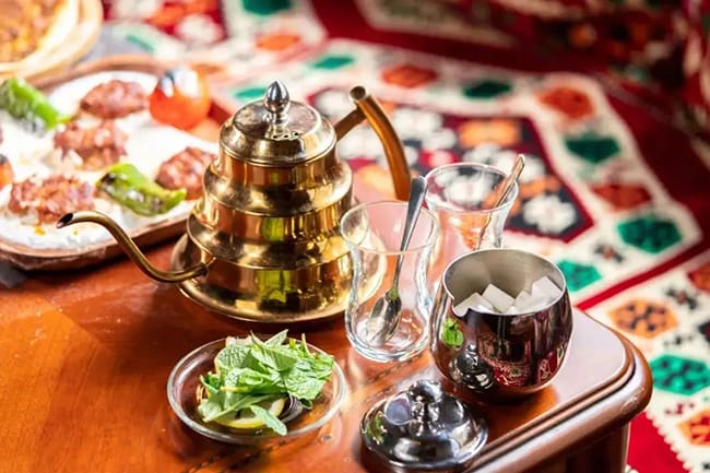 Turkish love drinking tea with lots of sugar in